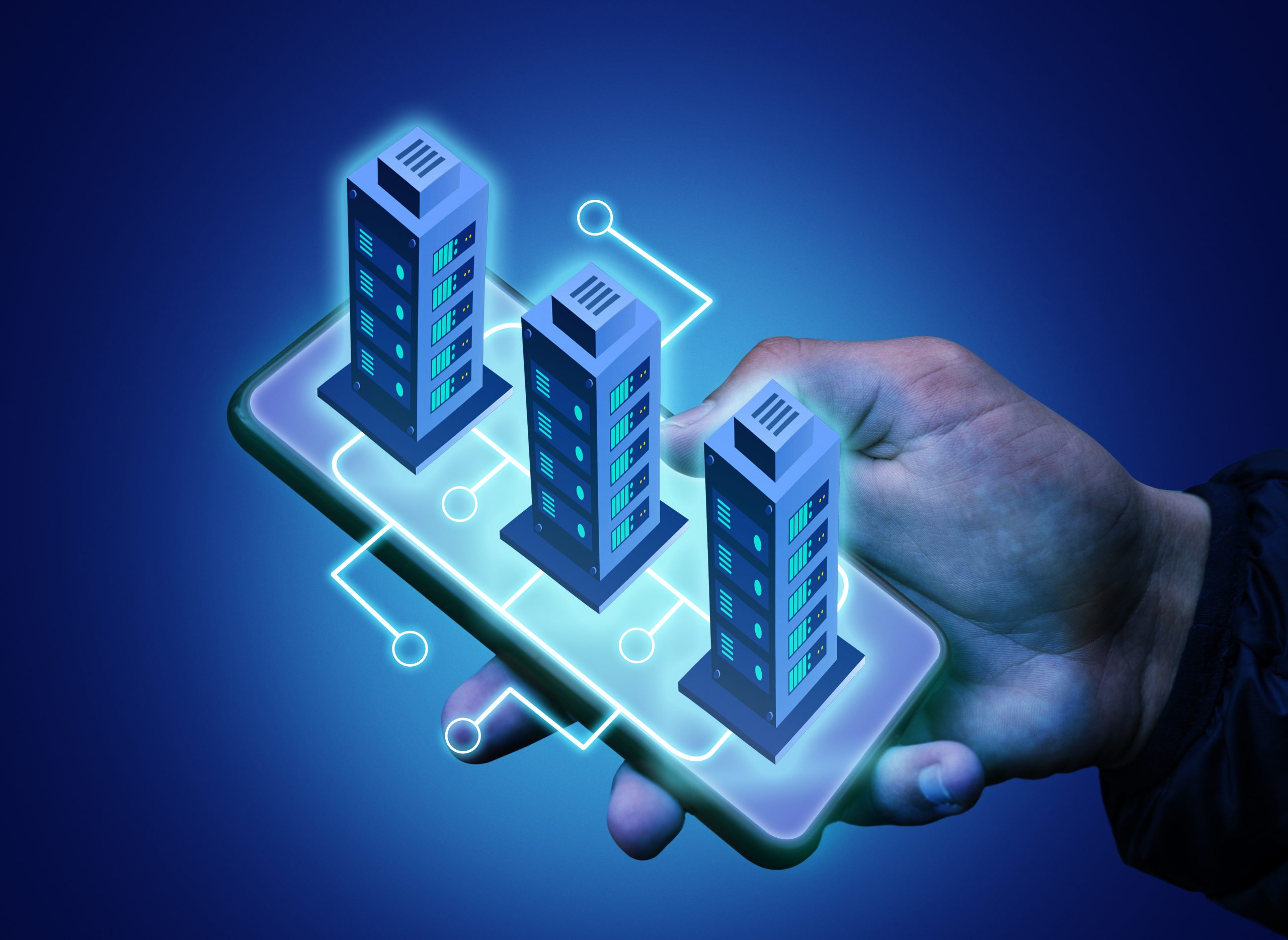 The image depicts a digitally enhanced concept of a hand holding a smartphone with a holographic projection of three futuristic server buildings. The glowing blue structures represent data centers or cloud computing, interconnected through circuit-like lines on the phone's surface. The dark blue background enhances the high-tech and digital theme, symbolizing modern technology, networking, and virtual infrastructure.