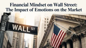 Realistic and minimalist image about finances on Wall Street, featuring the “WALL ST” street sign in the foreground, skyscrapers in the background, and an American flag displayed in front of a classic financial building. At the top of the image, the title “Financial Mindset on Wall Street: The Impact of Emotions on the Market” appears in an elegant dark font. The composition has soft lighting, balanced contrast, and a professional atmosphere focused on the American financial market.
